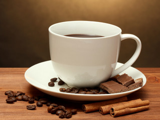 cup of coffee and beans, cinnamon sticks and chocolate
