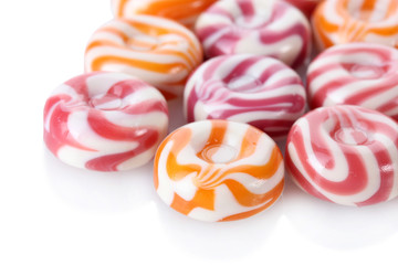 striped fruit candies isolated on white