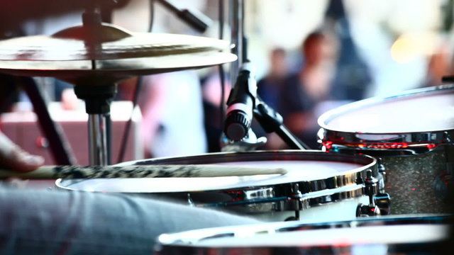 Musician playing drums at live concert