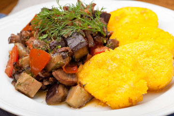 Polenta slices with vegetable stew