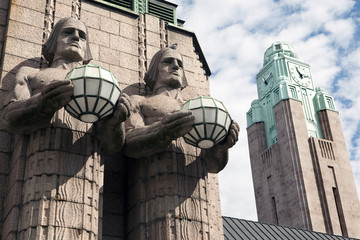 Twins and clock tower in the Helsinki Railway station. Finland. - obrazy, fototapety, plakaty