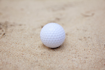Golf ball on sand