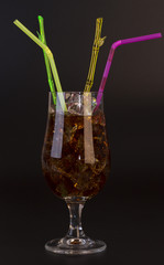 Whiskey with ice cubes and tubes