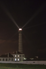 Lighthouse at night with beam enhanced.