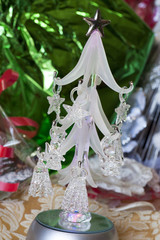 A small glass christmas tree with led