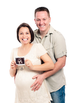 Happy pregnant couple with ultrasound picture