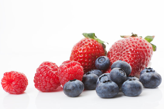 Raspberries, blueberries and strawberries. Delicious fruits.