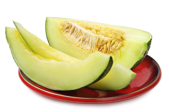 Melon slices on a red plate