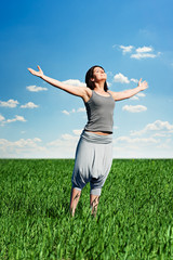 young woman relaxing at the field