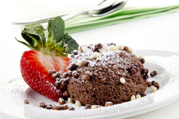 chocolate mousse and strawberry on a plate