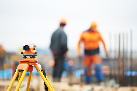 surveyor equipment level at construction site