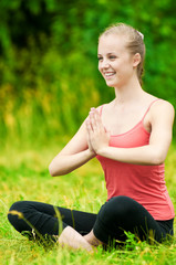 Fototapeta na wymiar Young woman doing stretching exercise