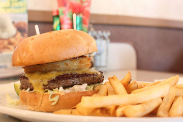 Delicious cheeseburger with french fries.