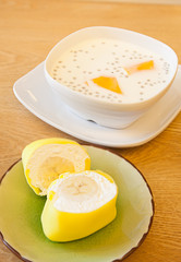 Breakfast: Milk and cake on table