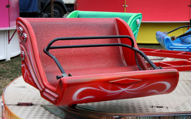 Naklejka premium The Empty Seats of a Fast Spinning Fun Fair Ride.