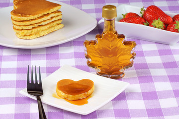 Mini heart-shaped pancake with syrup