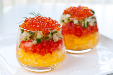 Caviar with vegetable  in glasses close up