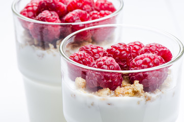 Yogurt with raspberries in a glass