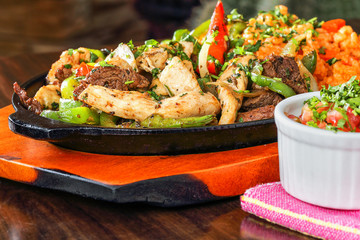 Mexican Cuisine Beef and Chicken Fajitas on a Hot Plate