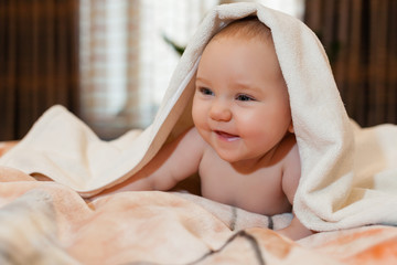 Fototapeta na wymiar Sweet small baby with towel