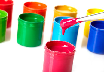 Paint buckets with paintbrush over white background