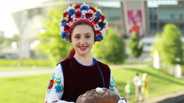 Ukrainian girl with a loaf near the Donbass Arena.  Euro-2012