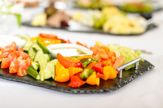Catering table buffet vegetable salad plate