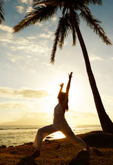 Fototapeta na wymiar Woman Doing Yoga at Sunset