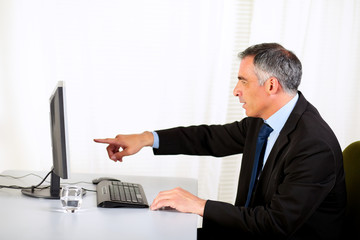 Businessman pointing the computer