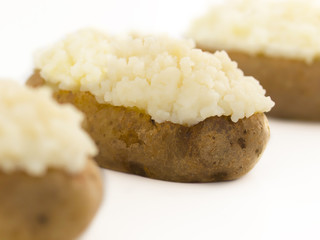 close up of baked potatoes