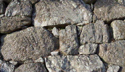 Background. Old stone wall