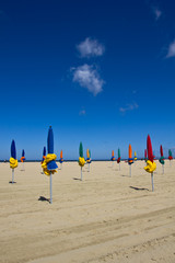 Closed beach umbrellas