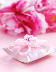 Pink present box with pacifier