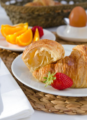 Breakfast setting with french croissants