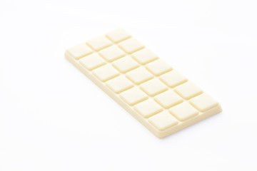 bar of white chocolate isolated on white