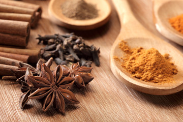 Herbs and Spices over wooden background