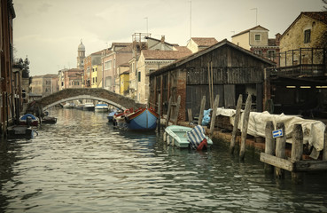 Fototapeta na wymiar Along an unknown canal in Venice, Italy