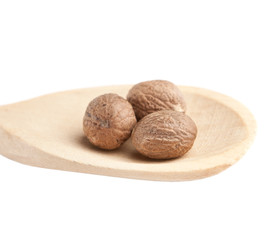 Nutmeg in a wooden spoon