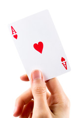 Ace of hearts being held over white