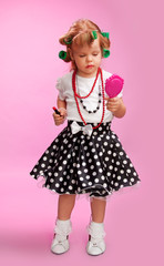 Little fashion-conscious girl, just like mother