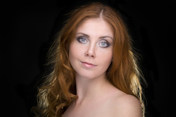 Closeup portrait of a redhead female model