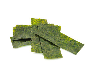 Pieces of seasoned dried seaweed isolated on white © sommai
