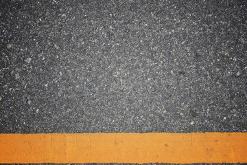 Fototapeta premium Asphalt road texture with yellow stripe
