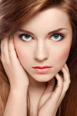 Close-up portrait of an attractive red-haired girl