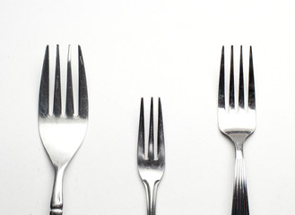 Silver fork on white background