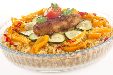Couscous with courgette and breaded chicken steak
