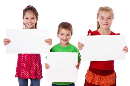 Three kids standing with empty blank