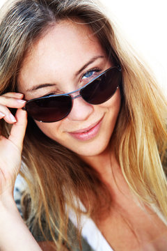 Portrait of blond woman with sunglasses on