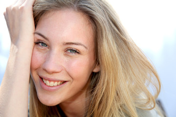 Portrait of beautiful blond smiling woman