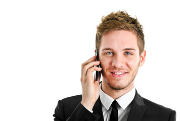 Handsome young businessman at phone